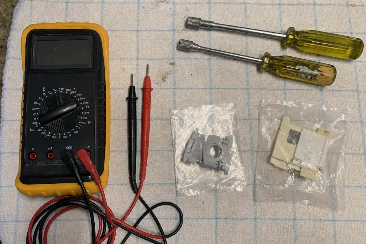 A commercial repair technician's tools laid out